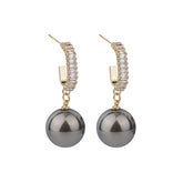 Stunning gray pearl and diamond drop earrings, crafted with 18K gold plating and shimmering cubic zirconia.
